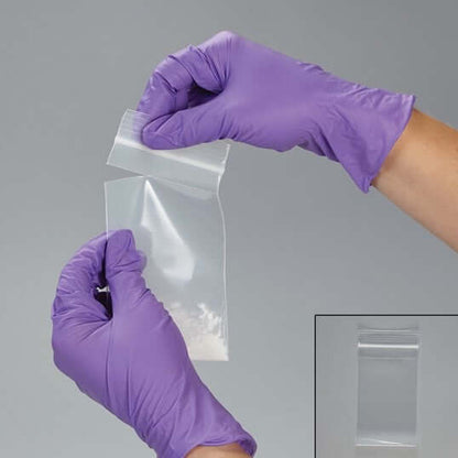 Hands Holding Crushed Pills inside the Perforated Pill Pouch