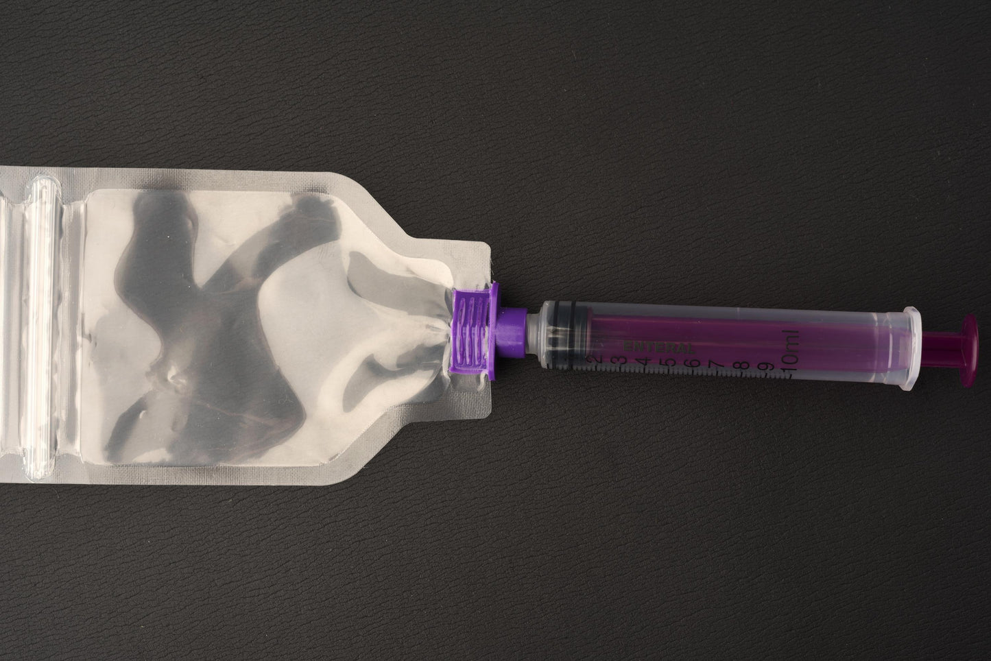Pill Pouch with Locking ENFit Connected to Syringe